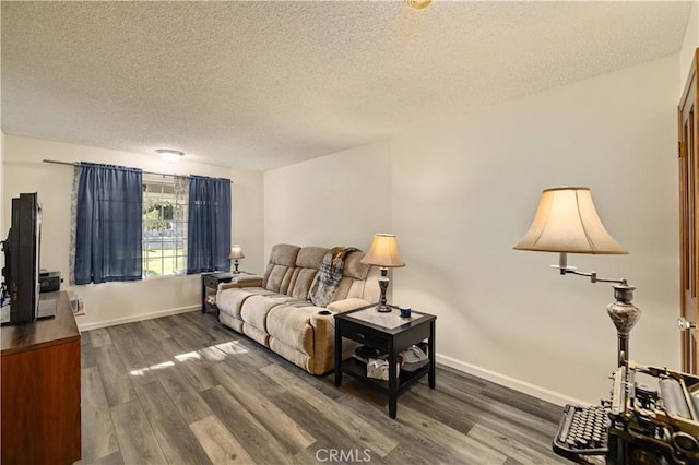 41018 40th St W, Palmdale, CA 93551 - living room with a textured ceiling, dark wood-style floors, and baseboards