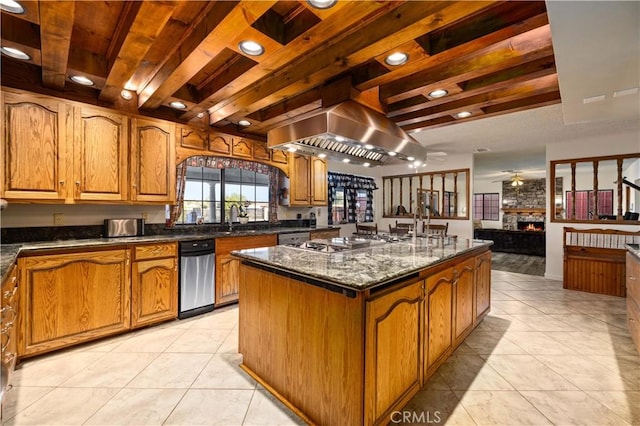 41018 40th St W, Palmdale, CA 93551 - kitchen featuring ceiling fan, stainless steel appliances, a fireplace, brown cabinets, and light tile patterned floors