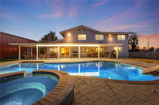 41018 40th St W, Palmdale, CA 93551 - view of pool with a pool with connected hot tub, a patio area, outdoor lounge area, and outdoor dining space