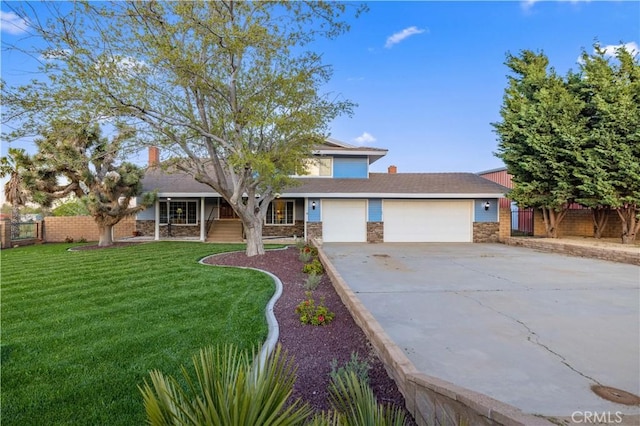 41018 40th St W, Palmdale, CA 93551 - view of front of house featuring driveway, an attached garage, and stone siding