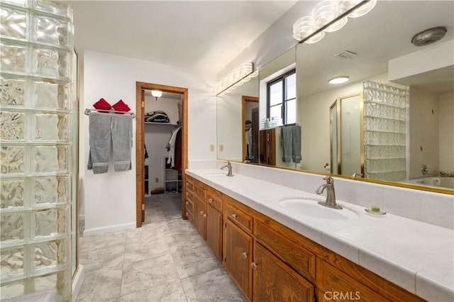 41018 40th St W, Palmdale, CA 93551 - full bath featuring a stall shower, double vanity, and a spacious closet