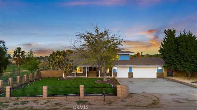 41018 40th St W, Palmdale, CA 93551 - ranch-style home with driveway, an attached garage, and stone siding