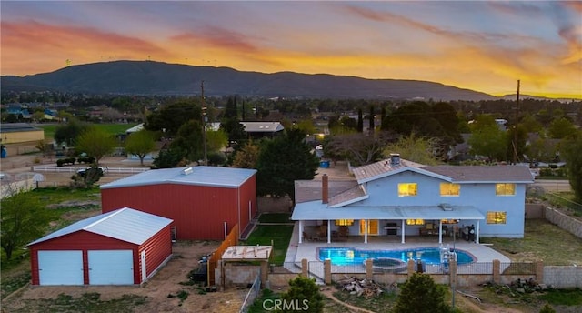 41018 40th St W, Palmdale, CA 93551 - view of pool with a fenced backyard, a mountain view, an outbuilding, and a pole building