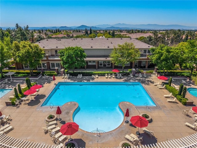 5384 Palestrina Way, Fontana, CA 92336 - pool featuring a mountain view and a patio area