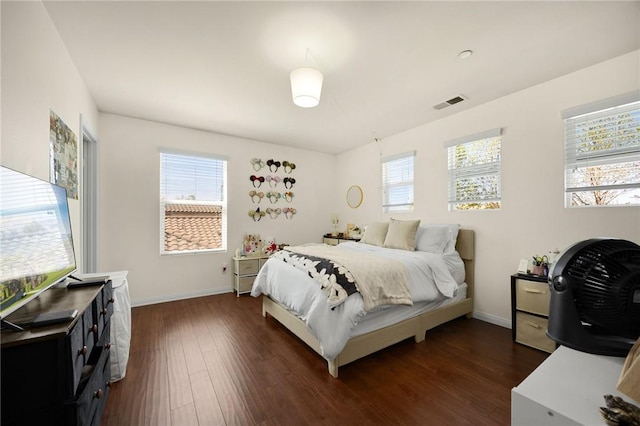 5384 Palestrina Way, Fontana, CA 92336 - bedroom featuring baseboards, dark wood-style floors, multiple windows, and visible vents