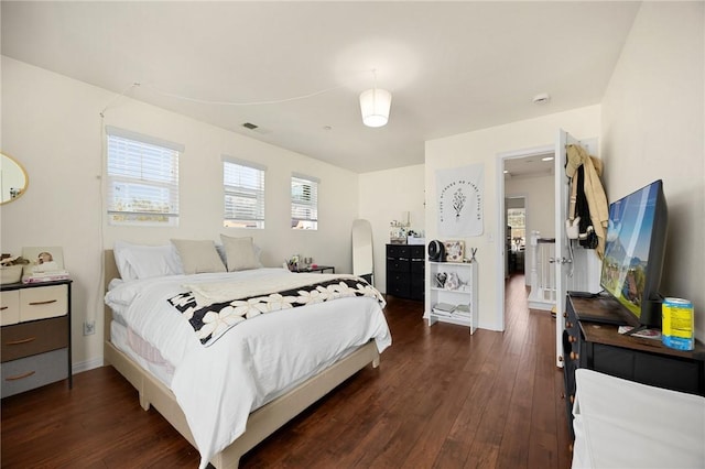5384 Palestrina Way, Fontana, CA 92336 - bedroom featuring visible vents, baseboards, and dark wood finished floors
