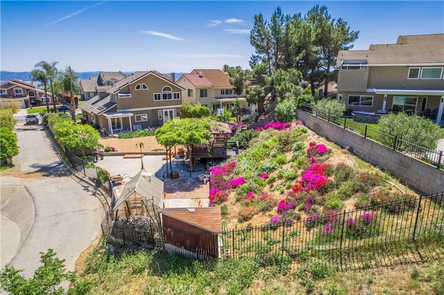 view of community with fence and a residential view