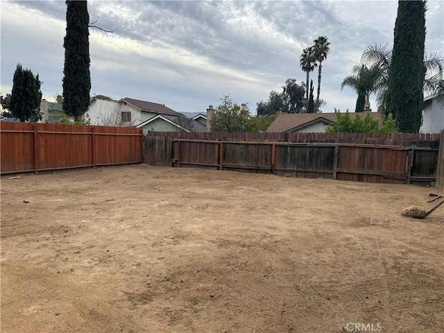 view of yard with a fenced backyard