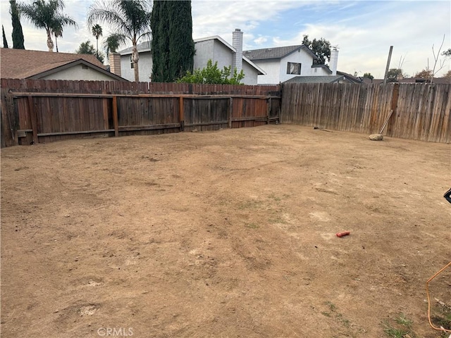 view of yard featuring a fenced backyard