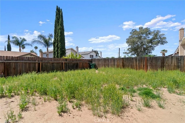 view of yard with a fenced backyard