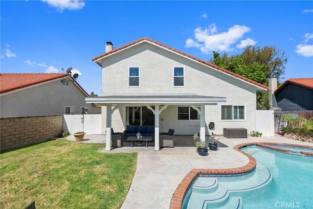 27884 Beacon St, Castaic, CA 91384 - rear view of house with an in ground hot tub, an outdoor living space, a lawn, a fenced backyard, and stucco siding