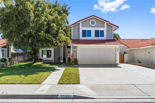 traditional-style house with a tiled roof, fence, driveway, and a front yard