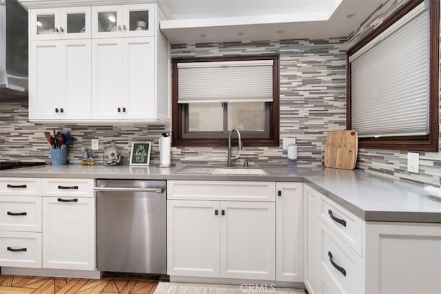 57 B Surfside Ave, Surfside, CA 90743 - kitchen with a sink, backsplash, white cabinetry, and dishwasher