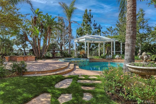 view of pool with a pergola and a pool with connected hot tub