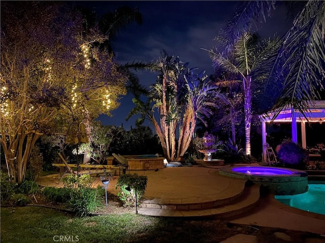 exterior space with a pool with connected hot tub