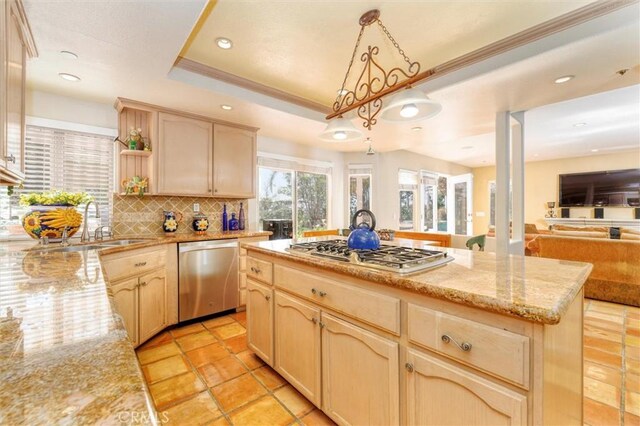 17816 Tuscan Dr, Granada Hills, CA 91344 - kitchen featuring appliances with stainless steel finishes, light brown cabinets, open floor plan, a sink, and tasteful backsplash
