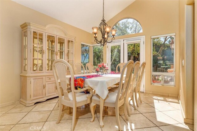 17816 Tuscan Dr, Granada Hills, CA 91344 - dining room with a chandelier, light tile patterned floors, high vaulted ceiling, and baseboards