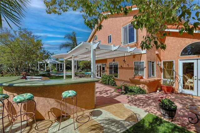 17816 Tuscan Dr, Granada Hills, CA 91344 - rear view of property with a pergola, stucco siding, a patio area, and french doors