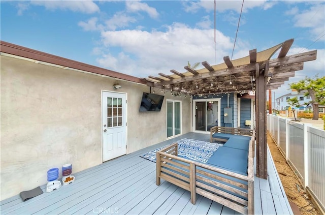 deck featuring a pergola, fence, and an outdoor hangout area