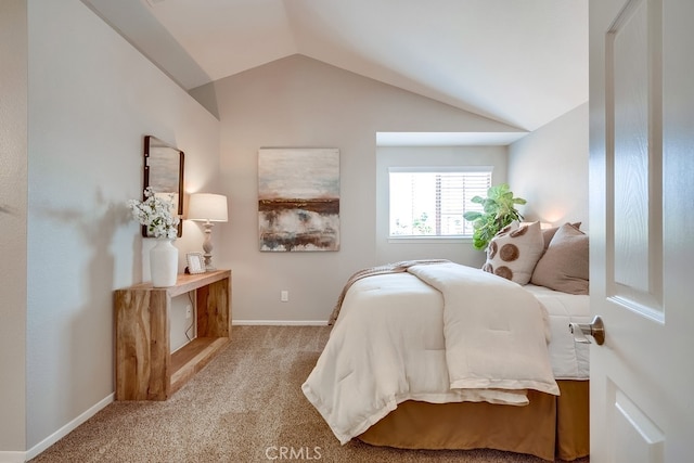 bedroom with carpet flooring, lofted ceiling, and baseboards