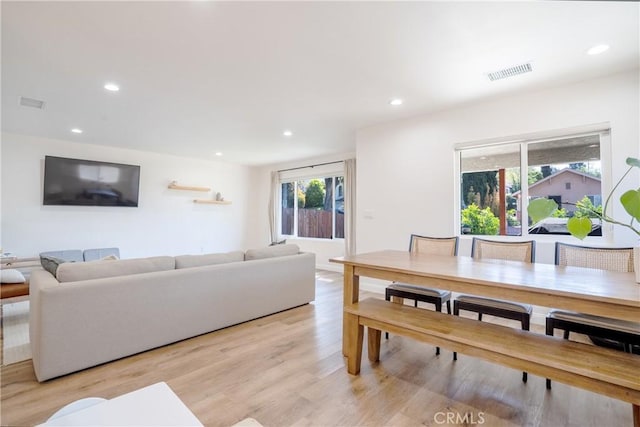dining space with recessed lighting, visible vents, and light wood-type flooring
