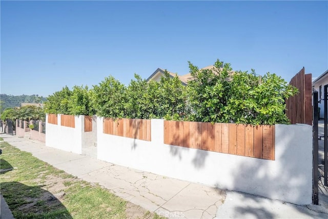 view of property exterior featuring fence