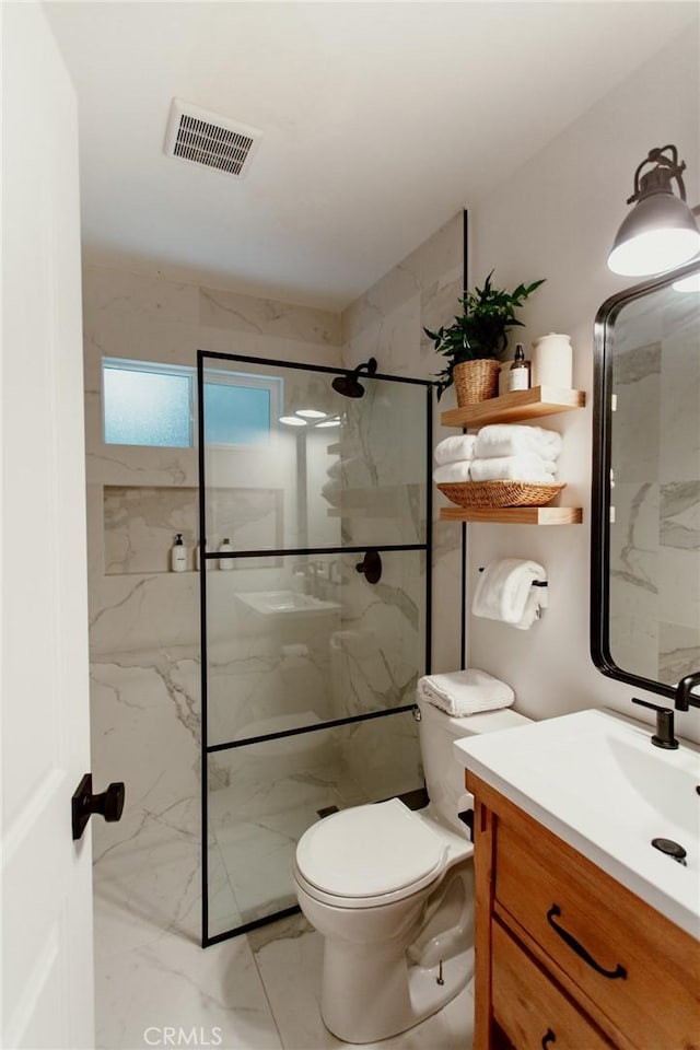 full bathroom with a marble finish shower, visible vents, marble finish floor, and vanity