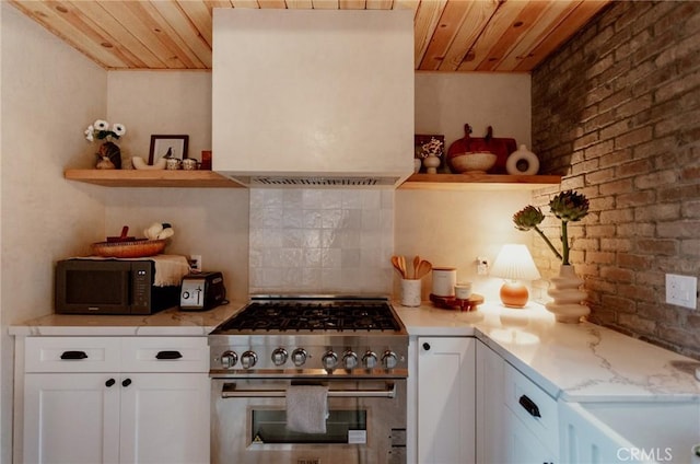 kitchen featuring black microwave, wooden ceiling, decorative backsplash, and high end stainless steel range oven