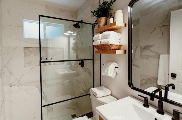 bathroom with toilet, a sink, and a marble finish shower