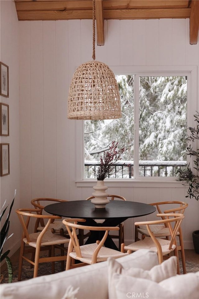 dining area featuring a decorative wall