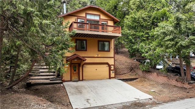 862 Strawberry Peak Rd, Twin Peaks, CA 92391 - chalet / cabin featuring stairs, an attached garage, and concrete driveway