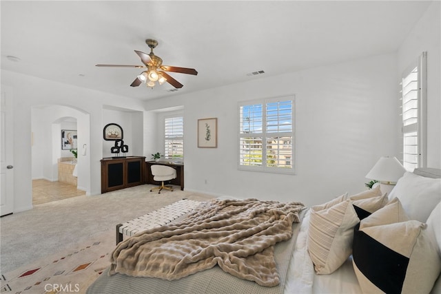 17245 Eagle Canyon Pl, San Diego, CA 92127 - bedroom with arched walkways, carpet floors, and a ceiling fan