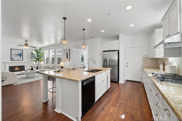 17245 Eagle Canyon Pl, San Diego, CA 92127 - kitchen featuring appliances with stainless steel finishes, a sink, under cabinet range hood, a ceiling fan, and open floor plan