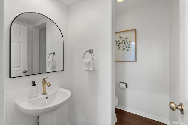 17245 Eagle Canyon Pl, San Diego, CA 92127 - bathroom featuring a sink, baseboards, wood finished floors, and toilet
