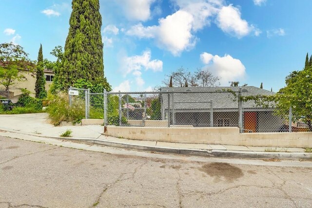 surrounding community with a gate and fence