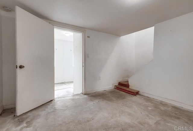 empty room featuring unfinished concrete flooring