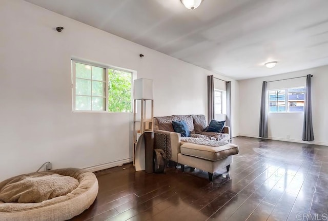 living area with dark wood finished floors and baseboards