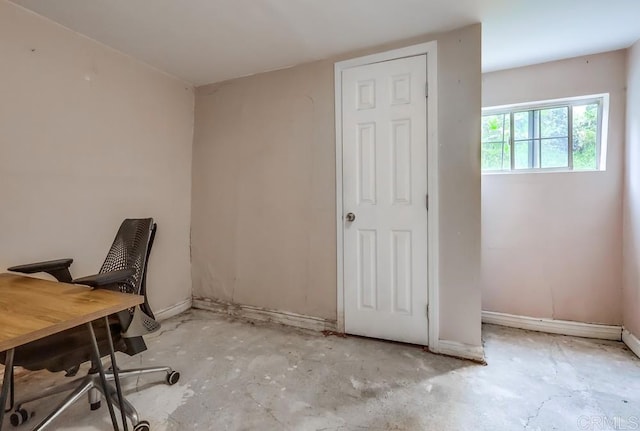 office space with baseboards