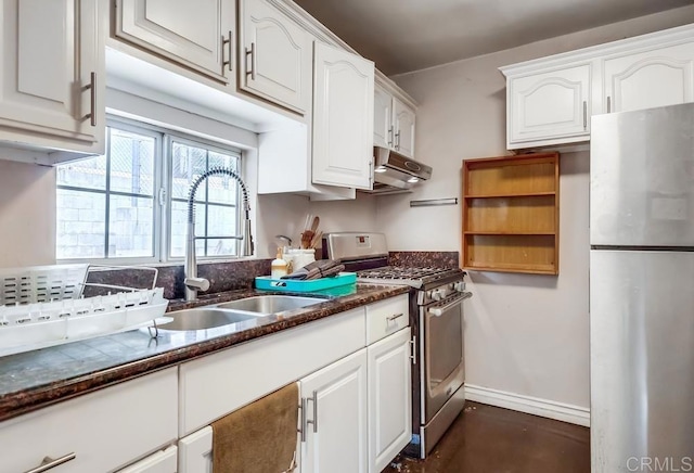 kitchen featuring white cabinetry, appliances with stainless steel finishes, under cabinet range hood, and a sink
