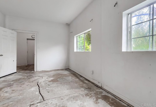 spare room featuring concrete flooring