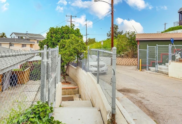 exterior space featuring fence and a gate
