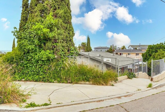 view of side of property with fence