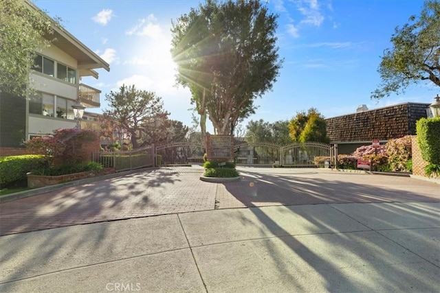 6542 Ocean Crest Dr Unit D308, Rancho Palos Verdes, CA 90275 - view of road featuring a gate, a gated entry, and curbs