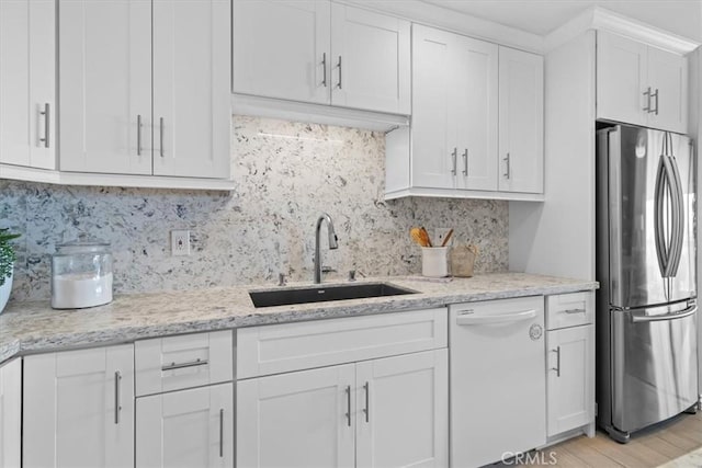 6542 Ocean Crest Dr Unit D308, Rancho Palos Verdes, CA 90275 - kitchen featuring freestanding refrigerator, white dishwasher, a sink, white cabinetry, and backsplash