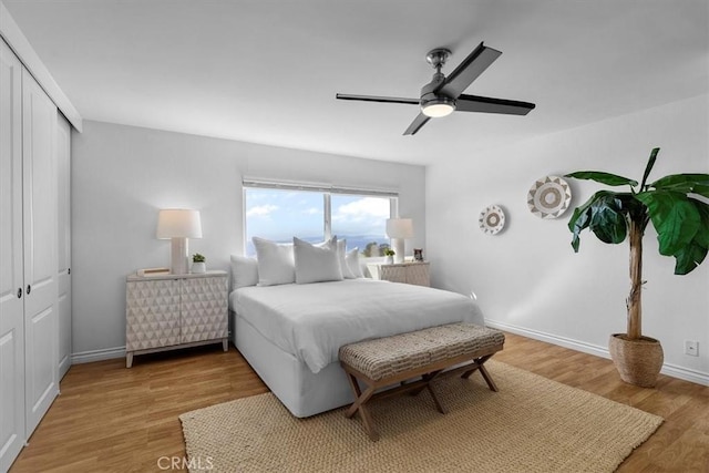 6542 Ocean Crest Dr Unit D308, Rancho Palos Verdes, CA 90275 - bedroom featuring light wood-style floors, a closet, a ceiling fan, and baseboards