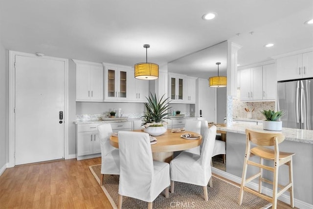 6542 Ocean Crest Dr Unit D308, Rancho Palos Verdes, CA 90275 - dining room with recessed lighting, light wood-style floors, and baseboards