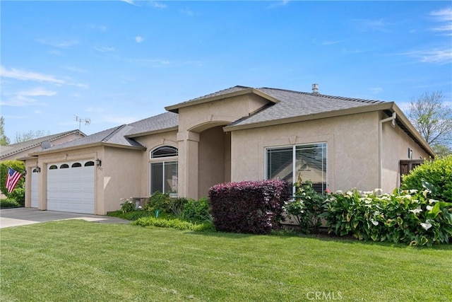 2327 Via Calle Ct, Durham, CA 95938 - ranch-style home with a front yard, an attached garage, and stucco siding