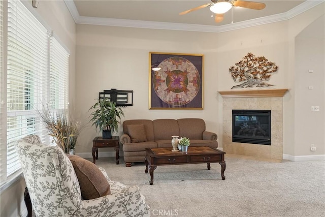 2327 Via Calle Ct, Durham, CA 95938 - living room with baseboards, ornamental molding, a tiled fireplace, ceiling fan, and carpet