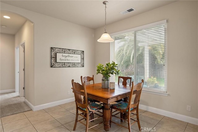 2327 Via Calle Ct, Durham, CA 95938 - dining area with arched walkways, visible vents, baseboards, and light tile patterned floors