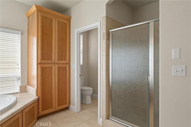 2327 Via Calle Ct, Durham, CA 95938 - bathroom featuring a shower stall, tile patterned floors, a bath, and toilet